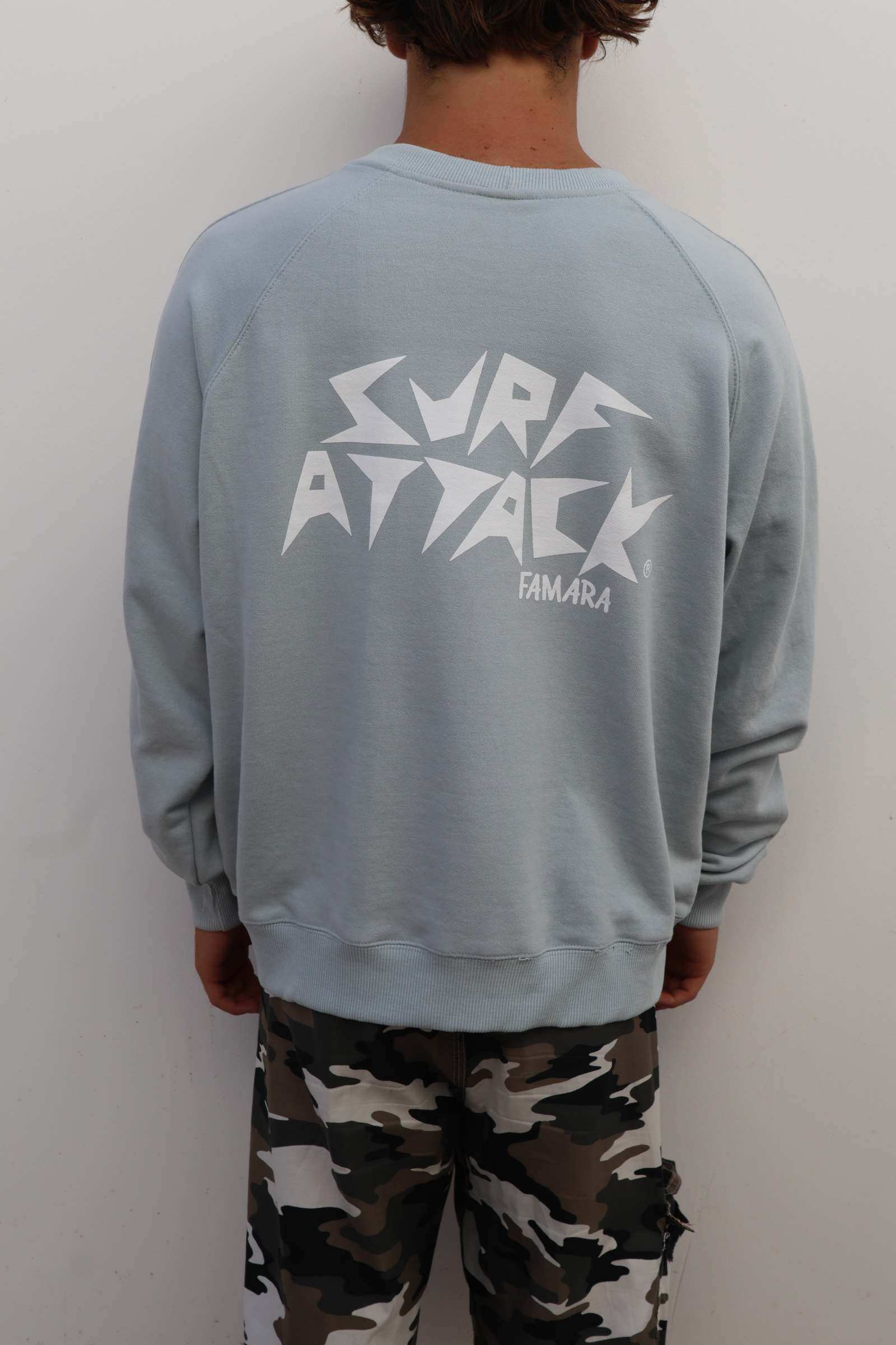 Light grey Surf Attack Sweatshirt with embroidered logo and soft cotton blend.
