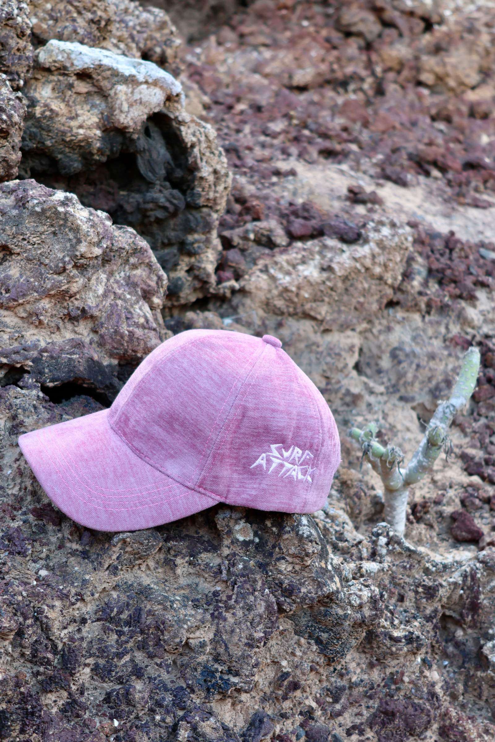 Surf Attack Retro Hat with minimalist embroidery, vintage wash, and adjustable cotton twill design.