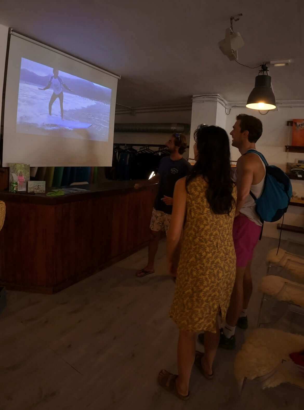 Group watching private surf lesson video at Surf Attack Famara shop in Lanzarote
